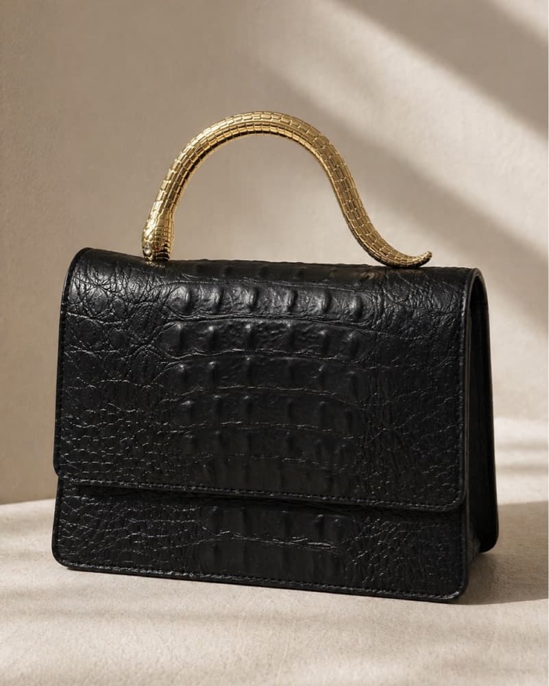 Black Satchel With Gold Snake Handle - Image 1