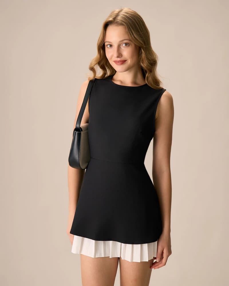 Chic Black Dress with Pleated Skirt - Image 1